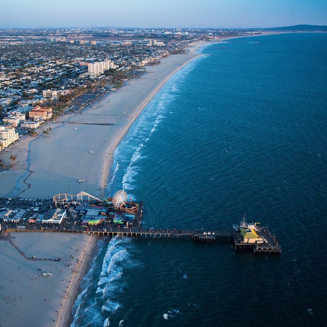 Drone shot of the beach and pier in Santa Monica. Photo by Instagram user @mdcshoots