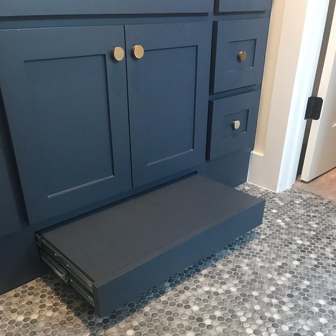 Hidden step stool added beneath bathroom vanity. Photo by Instagram user @cocotosscottgrouprealestate