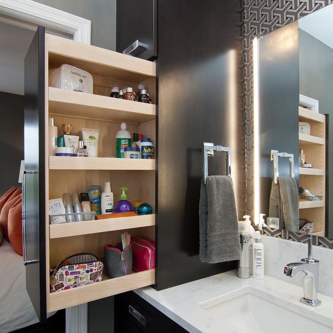 Pull Out Cabinet in a Renovated Bathroom. Photo by Instagram user @collegecitydesignbuild