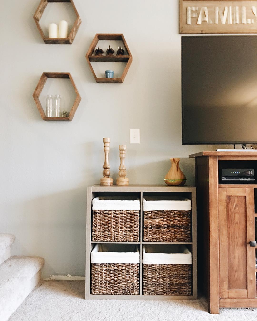 Living Room with Small Storage Shelf Holding Decorative Baskets. Photo by Instagram user @grayhavenreno