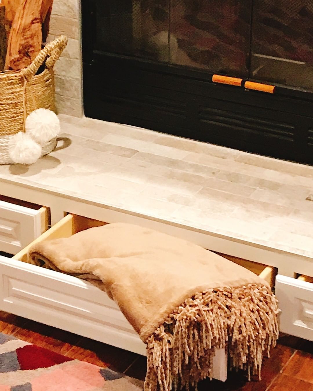 Fireplace Mantle with Built in Drawers Beneath Fireplace. Photo by Instagram user @lovedecor.homestaging