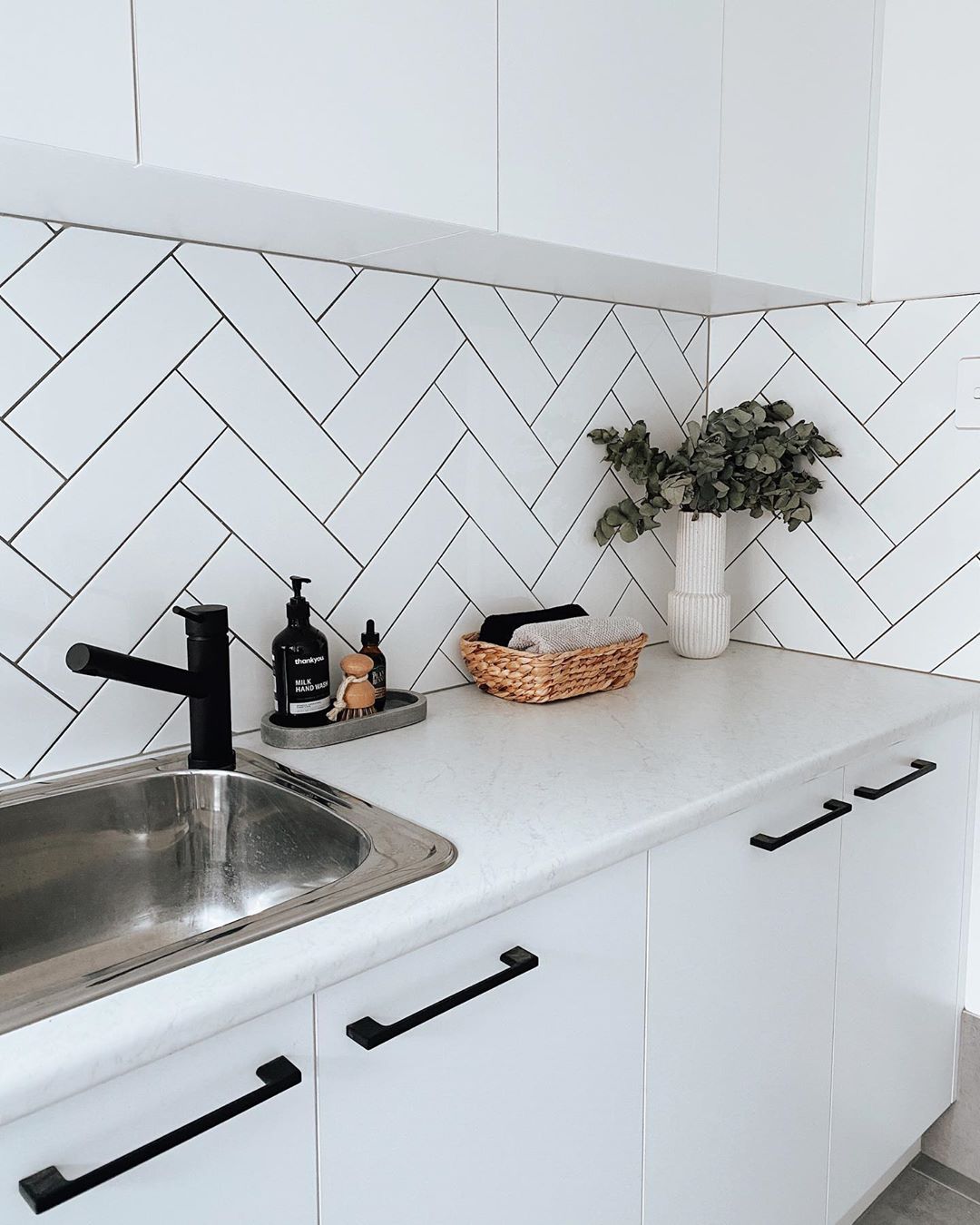 Updated Kitchen with White Cabinets and Subway Tile Backsplash. Photo by Instagram user @housetwentyfive