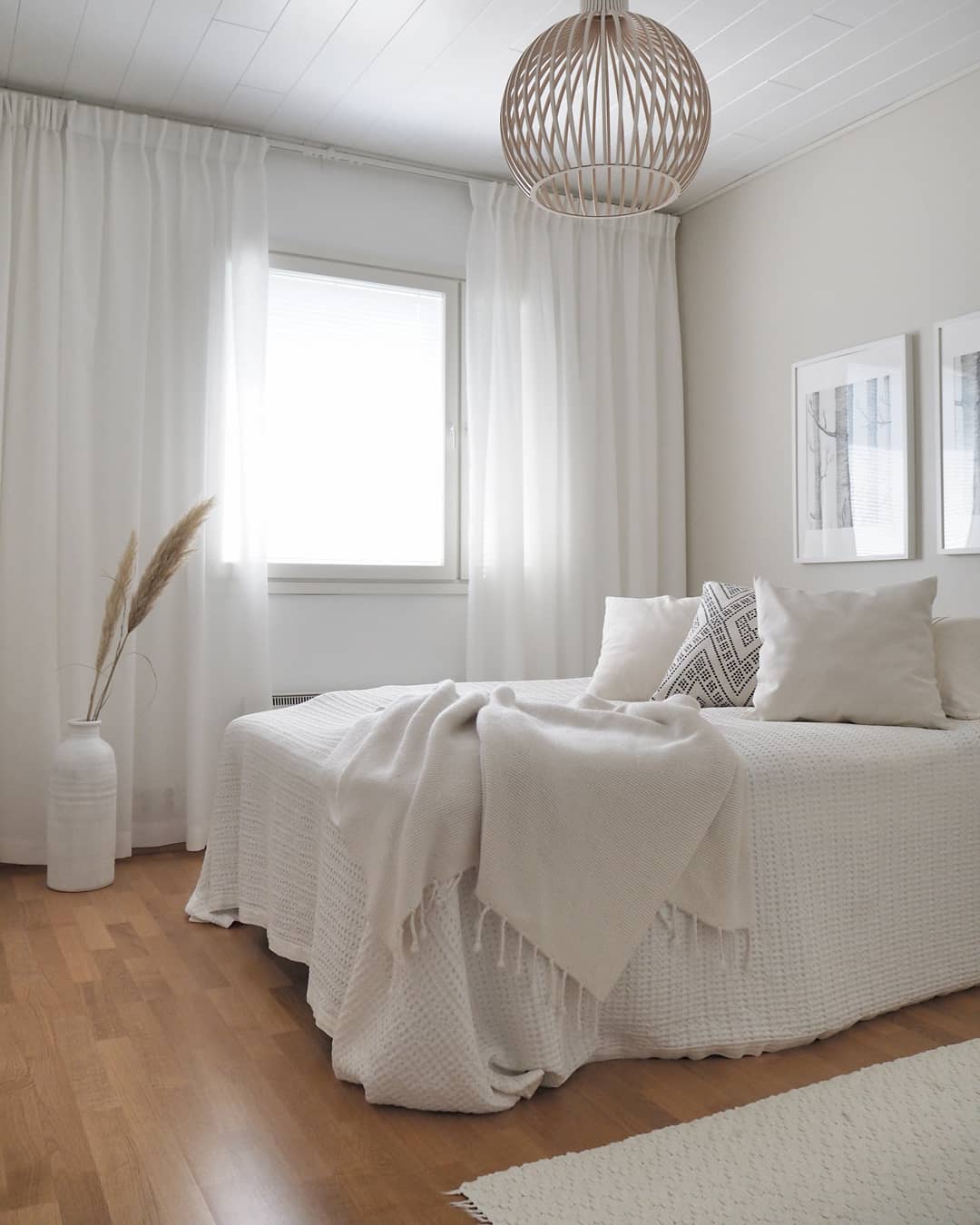 Mimimalist Bedroom with White Bedding and Simple White Curtains. Photo by Instagram user @homebykoskela