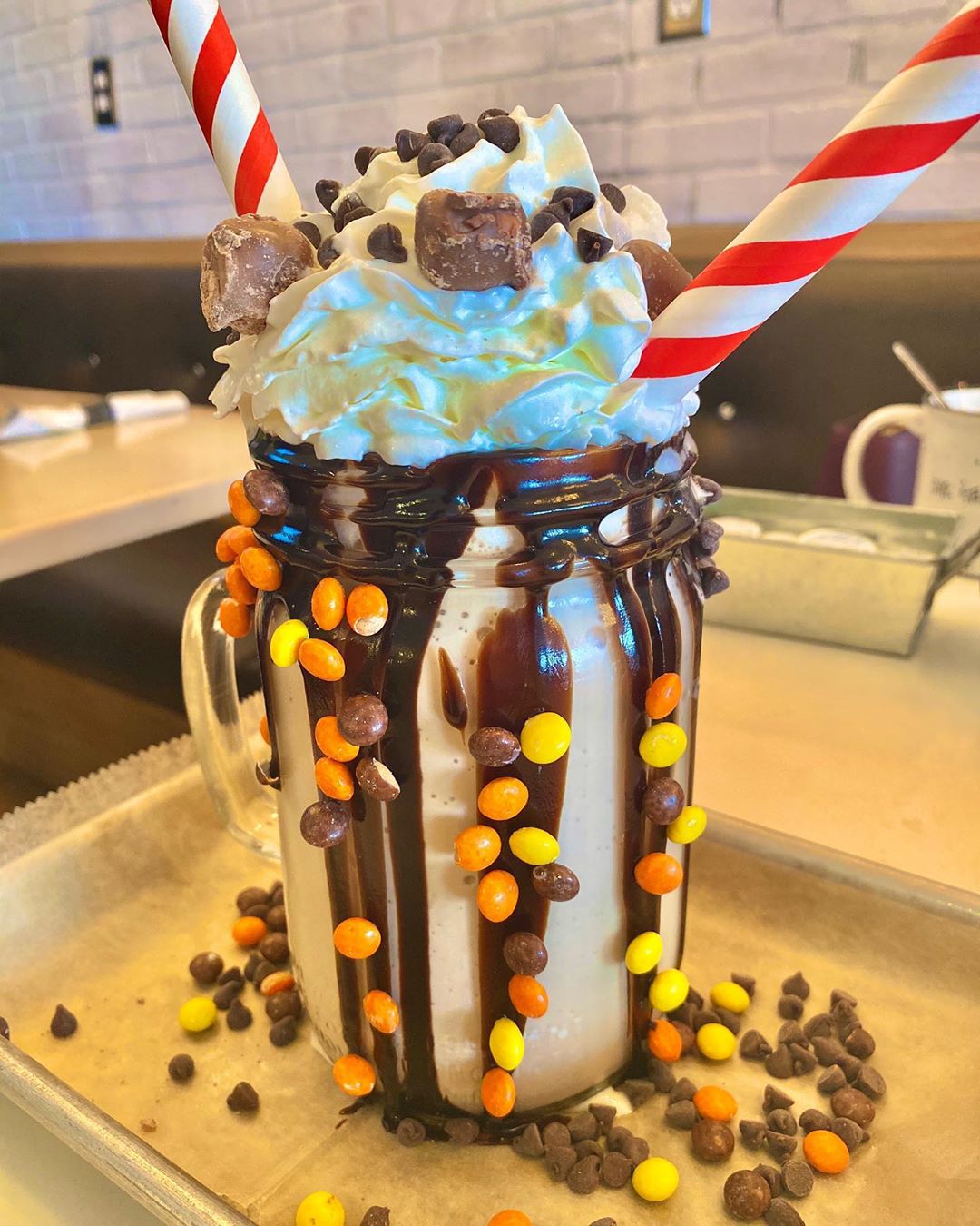 Milkshake Covered in Candy with Two Large Straws from The Place 2 Be. Photo by Instagram user @ctfoodcravings