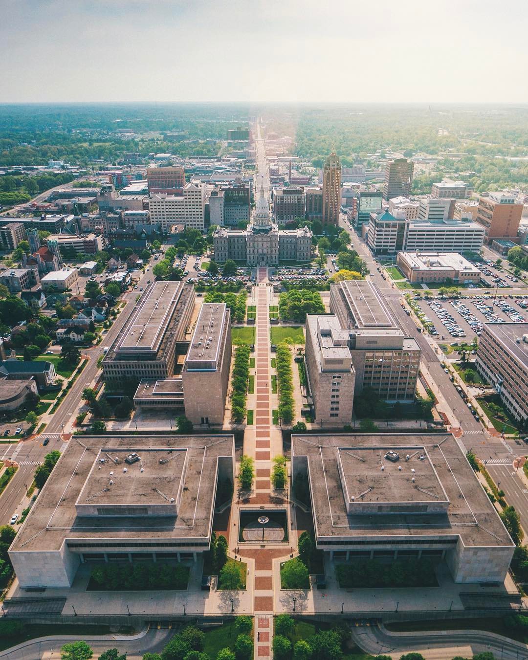 Aerial View of Downtown Lansing, MI and the Michigan State House. Photo by Instagram user @drewmason