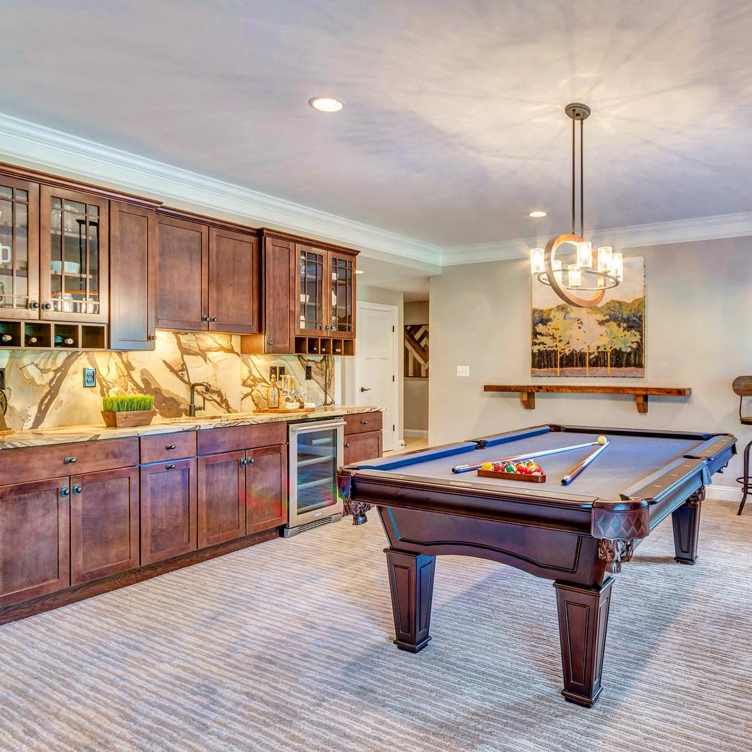 Updated Basement with a Pool Table and Bar Area. Photo by Instagram user @stanleymartinhomes