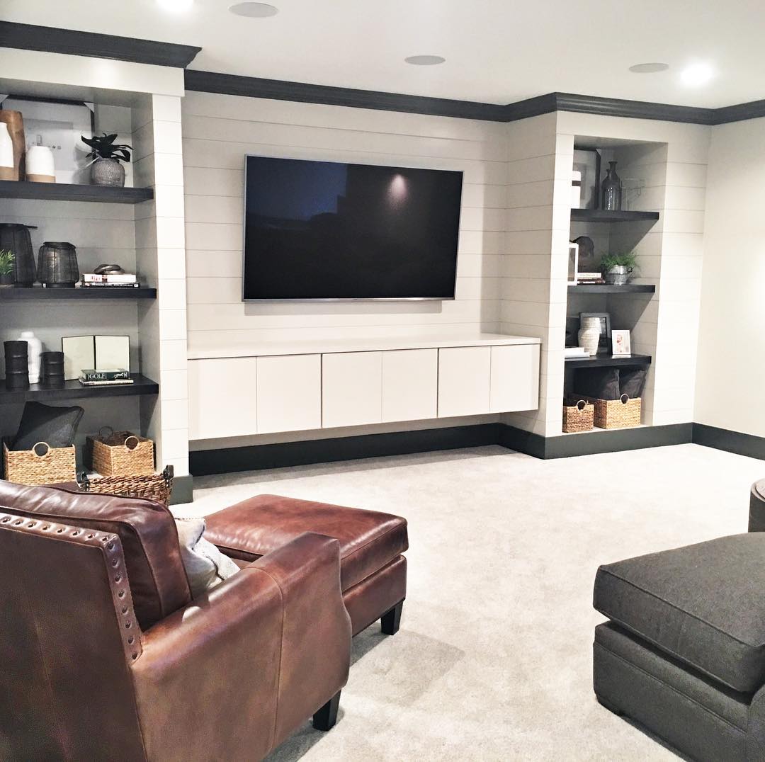 Finished Basement with Built in Shelving and Shiplap on Walls. Photo by Instagram user @mbkdesign_indy