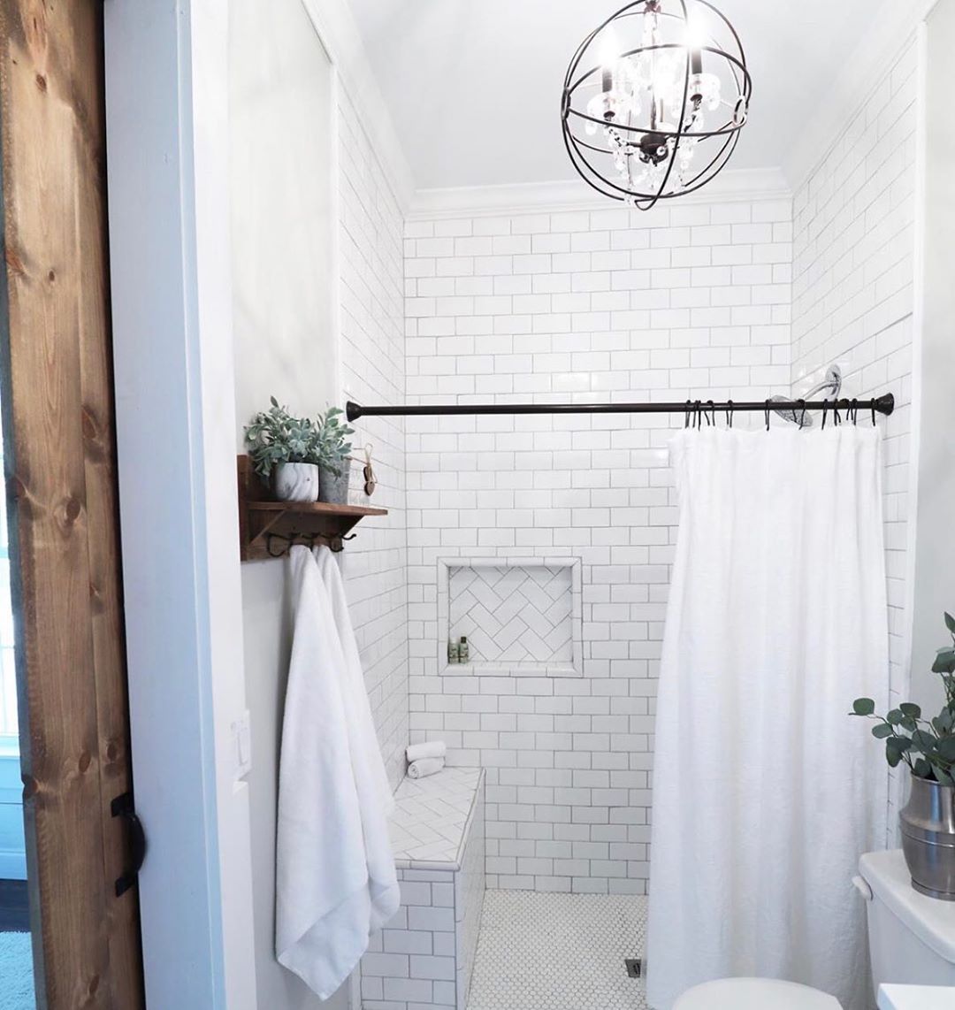 Renovated Bathroom with Subway Tile in Shower. Photo by Instagram user @thedawsonhouse_