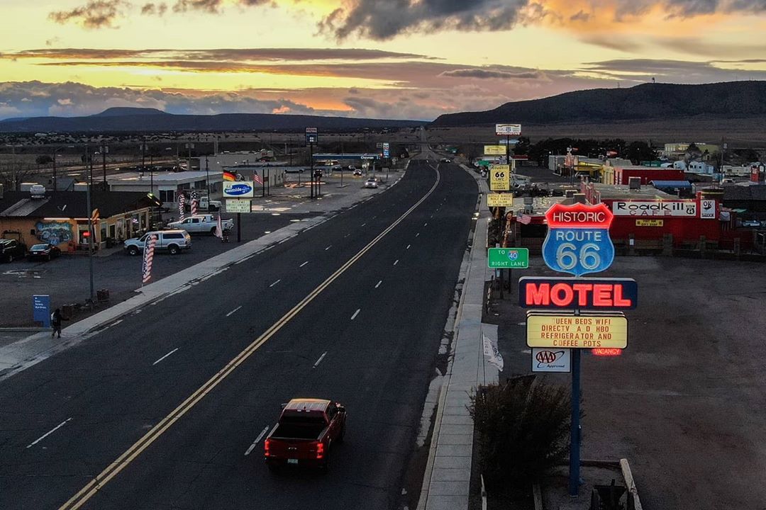 Open Road with One Car in Seligman, AZ. Photo by Instagram user @wanderinwhilewecan