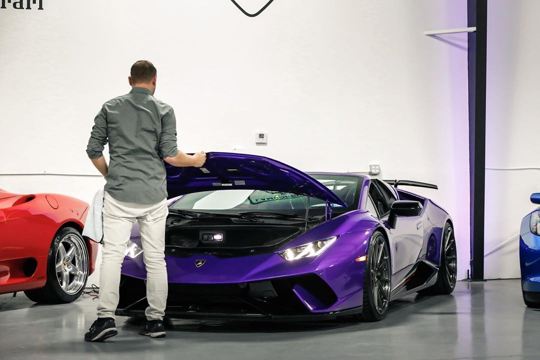 Man Closing the Boot of a Purple Lamborghini Huracan. Photo by Instagram user @wergs_automotive