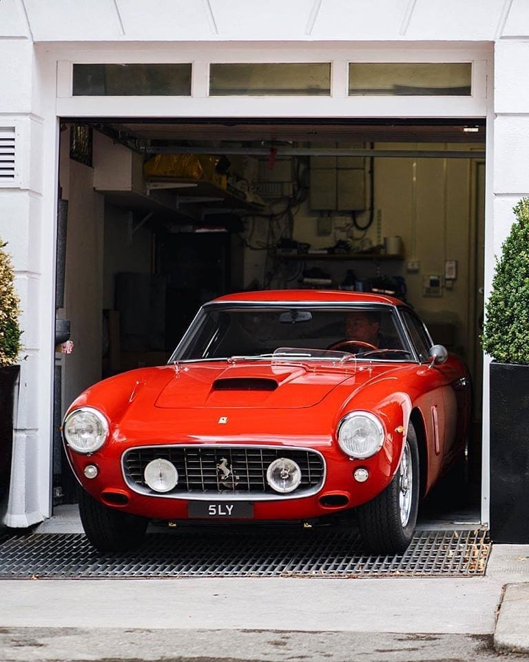 Red Ferrari 250 GT Driving Out of a Home Garage. Photo by Instagram user @dinocontin_classic
