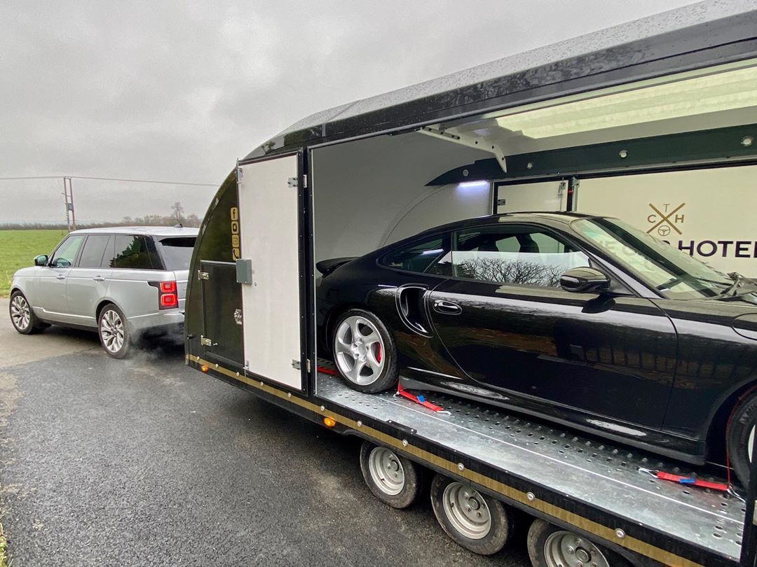 Black Porsche 996 Turbo Sitting In a Secure Car Trailer. Photo by Instagram user @the_car_hotel