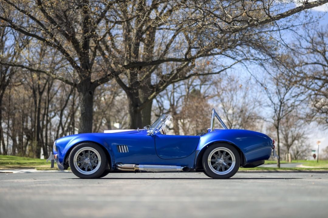 1965 Blue Shelby Cobra in a Park. Photo by Instagram user @morriesheritage