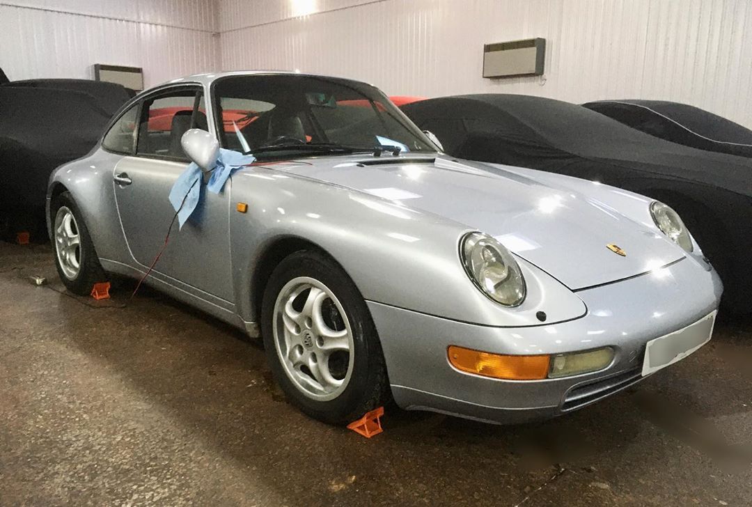 Classic Gray Porsche Parked with Wheel Blocks in Storage. Photo by Instagram User @prideandjoystorage