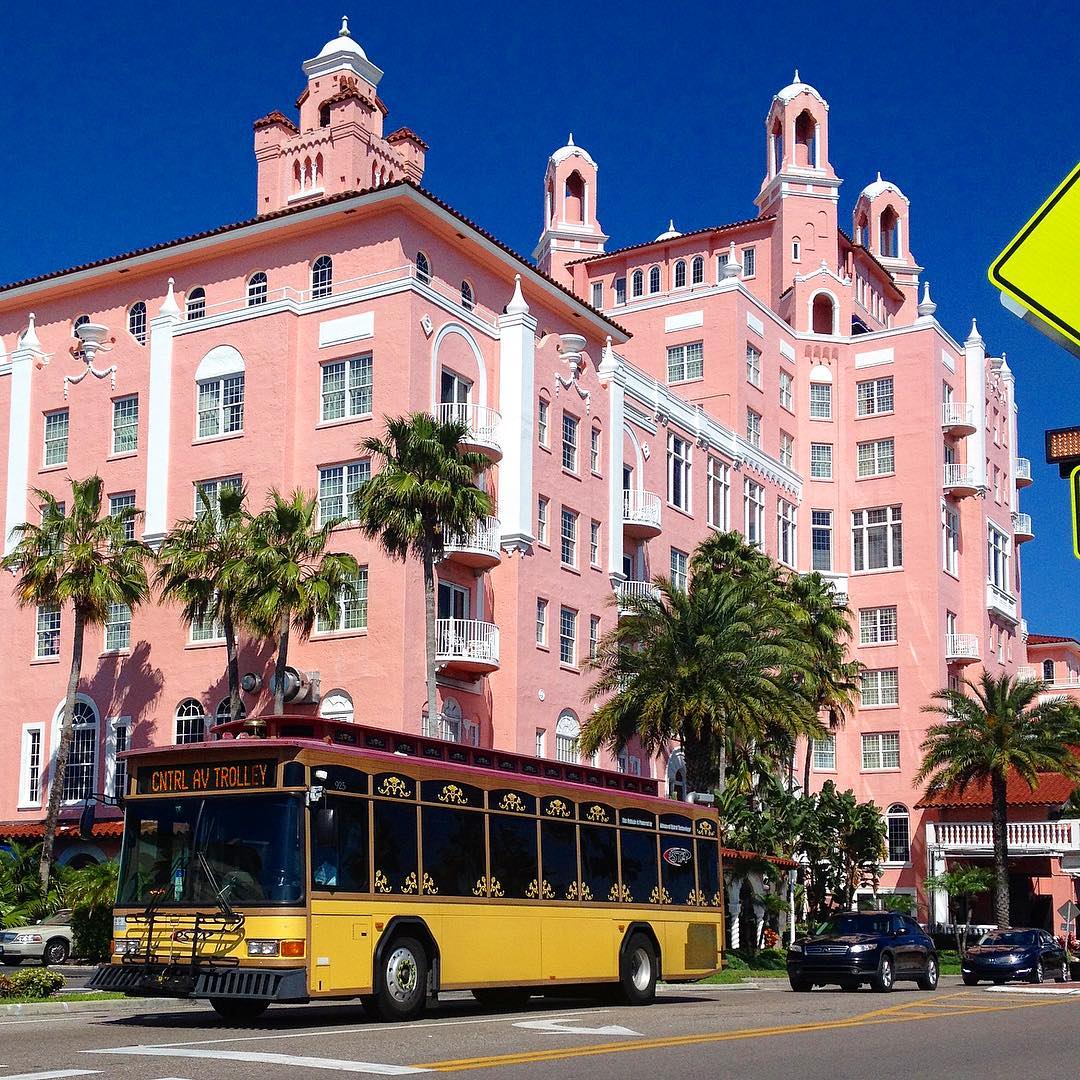 Yellow Trolley Outside of Pink Building. Photo by Instagram user @ridepsta