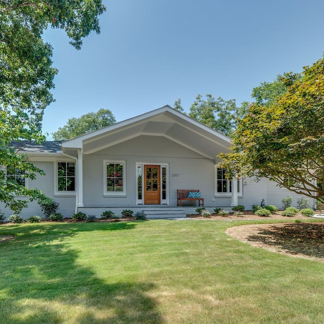 Gray Ranch Style Home with Large Front Patio in West Raleigh. Photo by Instagram user @chappellres