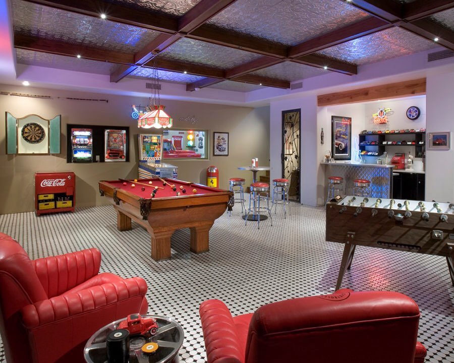 Basement Game Room with Pool Table, Foosball, and a Bar. Photo by Instagram user @sandverealty