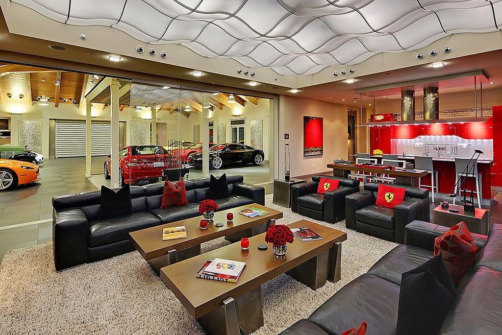 Man Cave Hangout Space Next to a Garage Filled with Nice Cars. Photo by Instagram user @mancavemasters