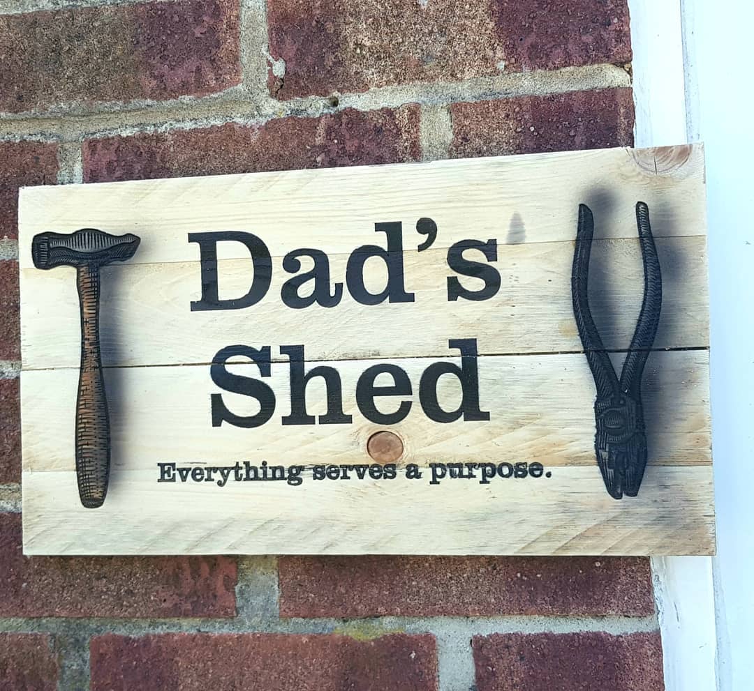 Engraved Wood Sign that says "Dad's Shed." Photo by Instagram user @thorncroft.engraving