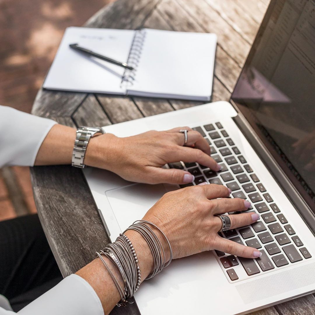 Woman's Hands Typing on a Laptop. Photo by Instagram user @synergize_support_ltd