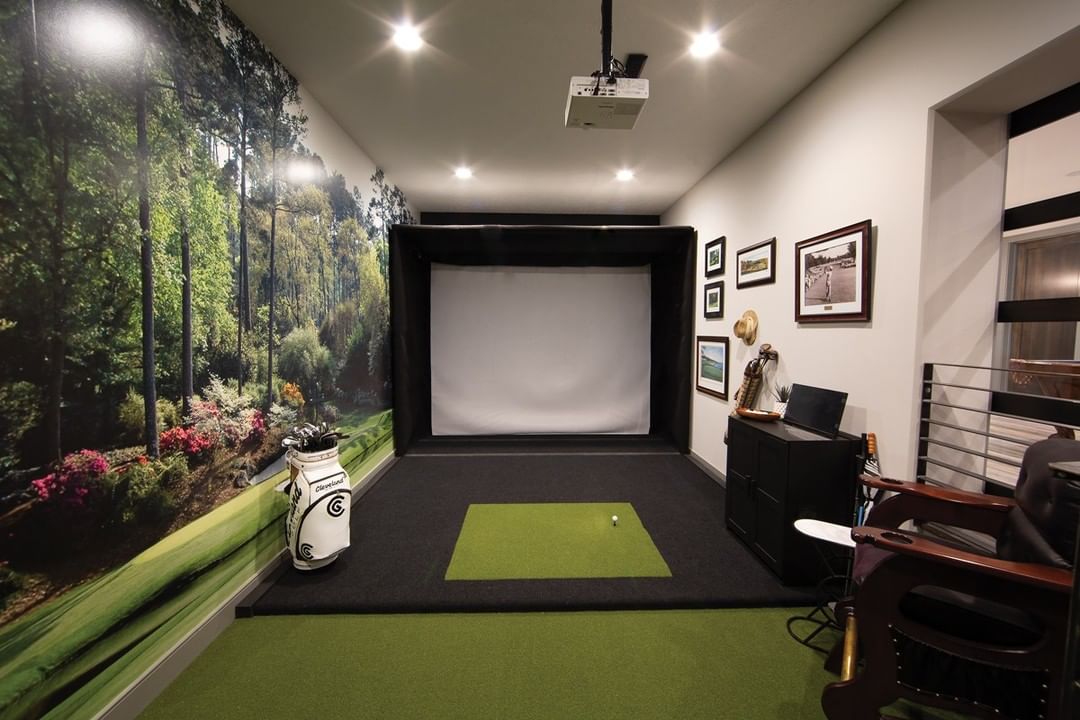 Basement Golf Simulator with Screen on the Wall and Mounted Projector. Photo by Instagram user @rainorshinegolf