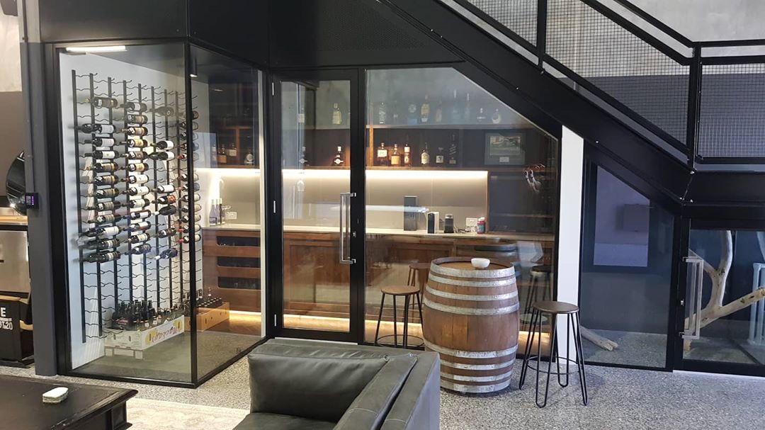 Under Stairs Wine Room with Glass Walls. Photo by Instagram user @caesarcellars