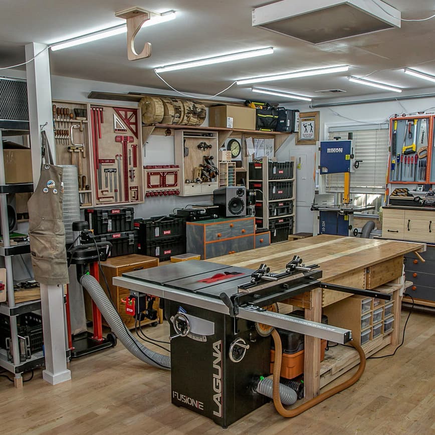Well Organized Home Workshop with Work Bench and Table Saw Set Up. Photo by Instagram user @radeksworkshop
