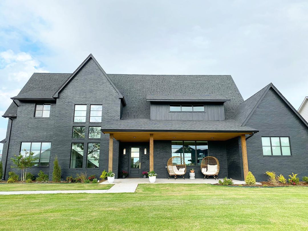 Black Modern Home with Minimalistic Design in Piedmont, Oklahoma. Photo by Instagram user @modernokc