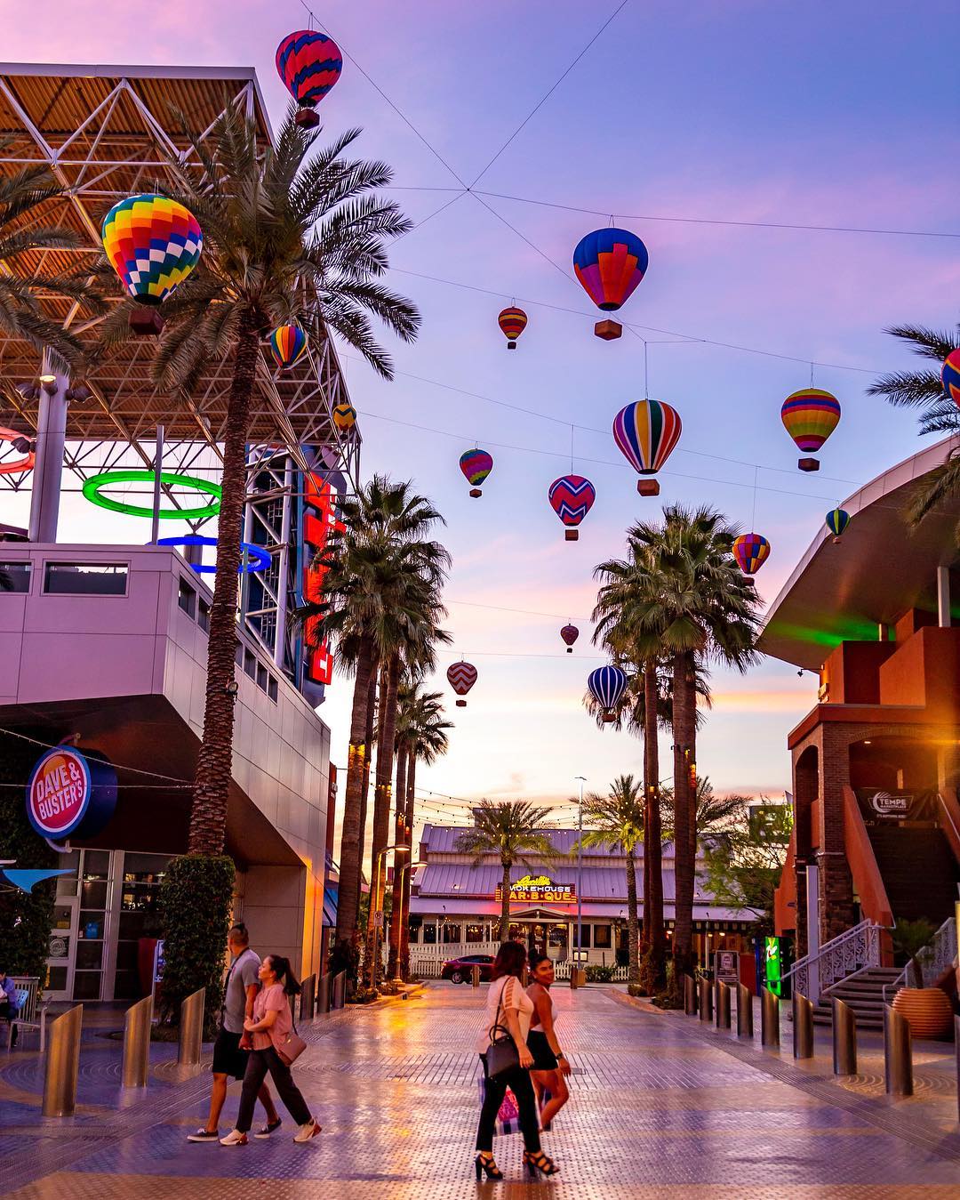People Walking Around at Tempe Marketplace Under Fake Hot Air Balloons. Photo by Instagram user @tempemarketplace