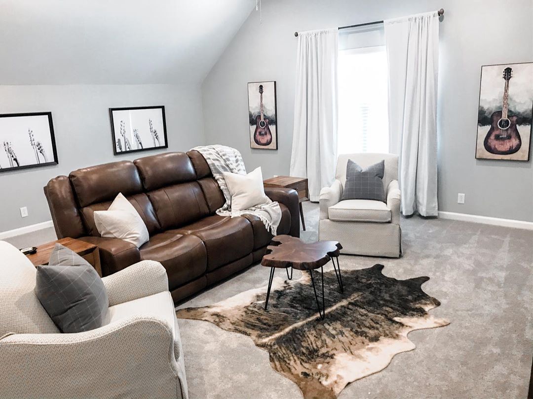 Minimalistic Man Cave in Attic With Leather Couch. Photo by Instagram user @grace_by_designs