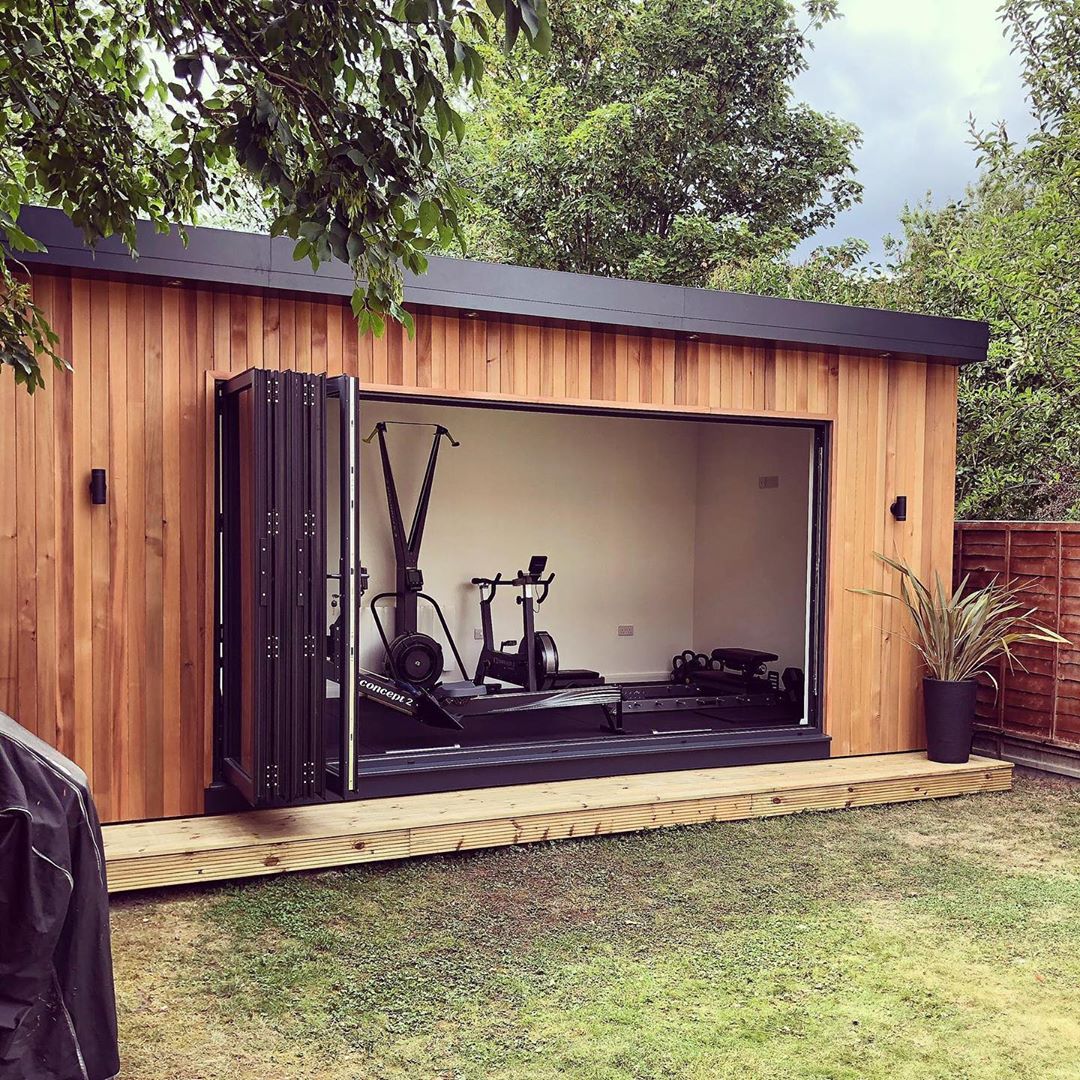 Backyard Home Gym in a She Shed with Sliding Glass Doors. Photo by Instagram user @smartmodular