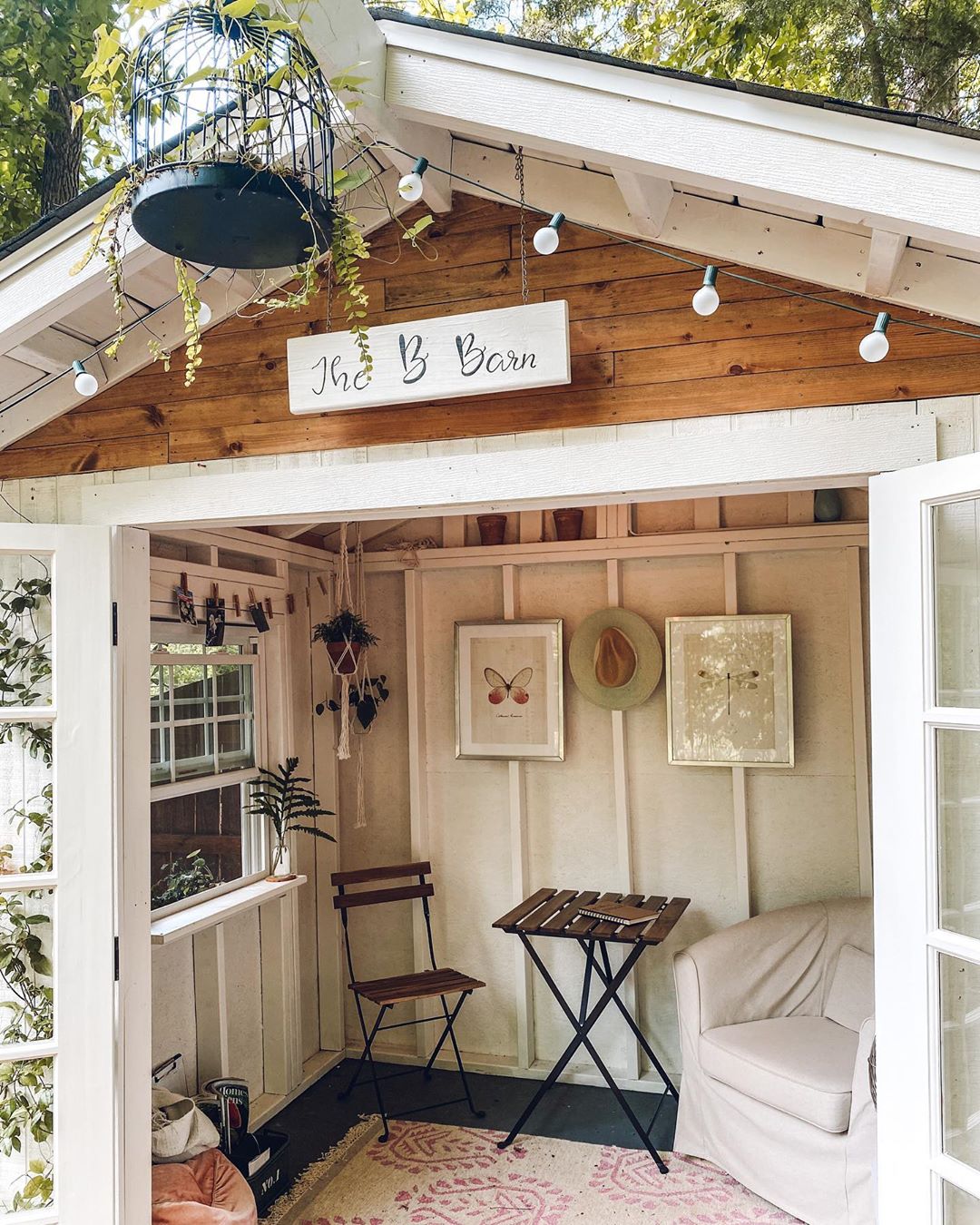 Small She Shed with a Soft Corner Chair and Sign Above the Door. Photo by Instagram user @theeverhopefulgardener