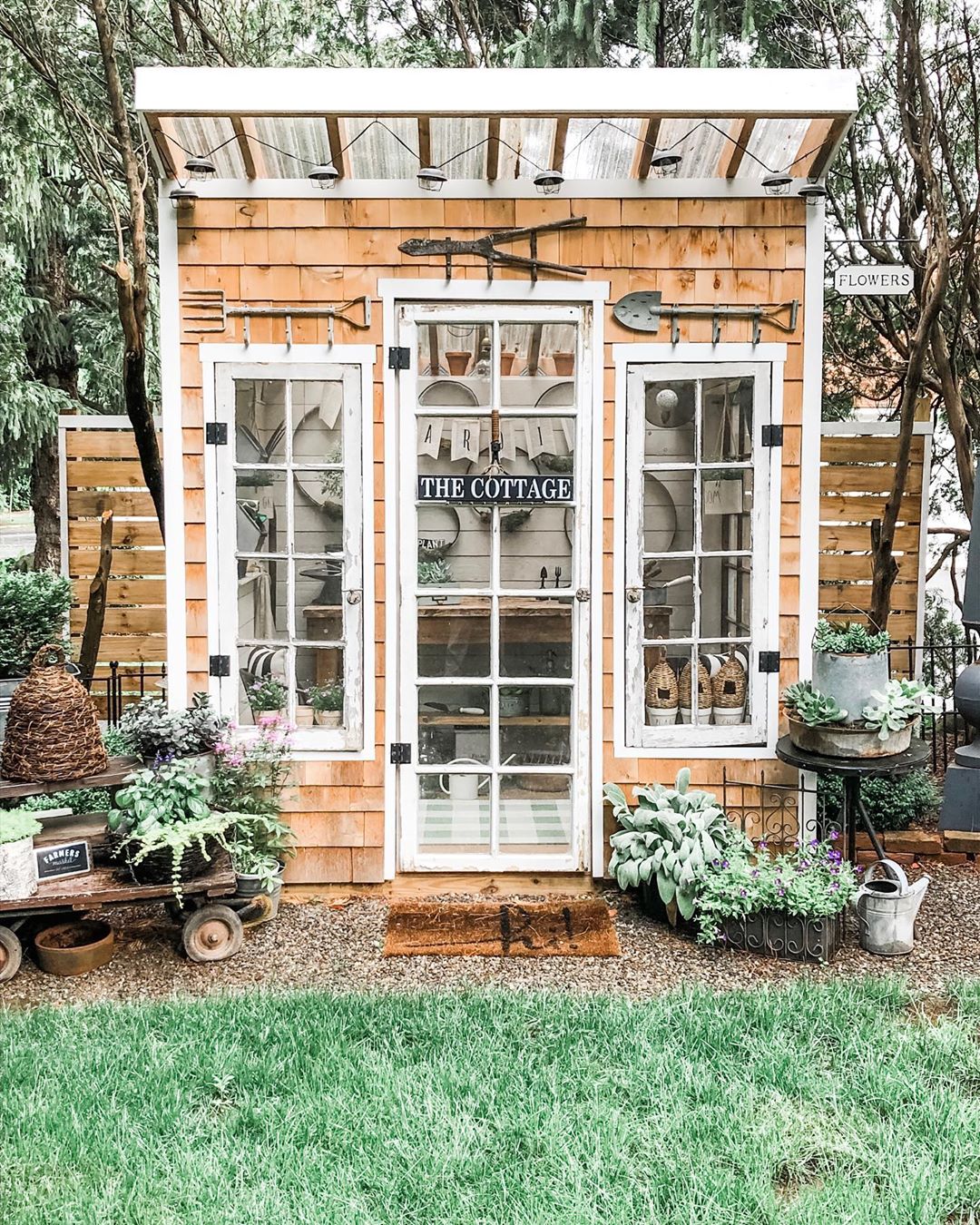 Small Wooden Shingle Sided Garden She Shed. Photo by Instagram user @cottageandbloom