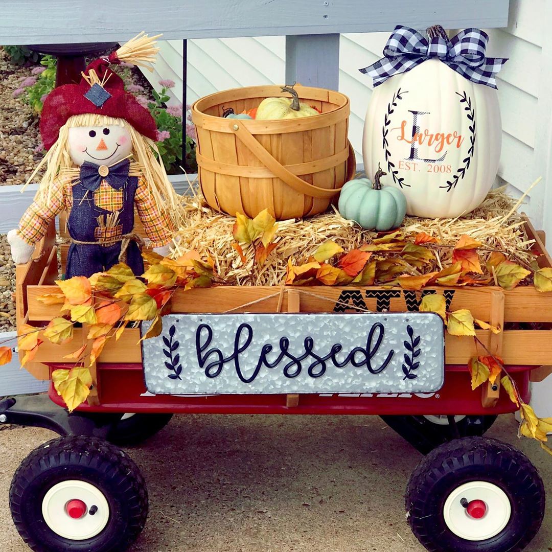 Small Red Rider Wagon Decorated in Fall Items. Photo by Instagram user @farmersburgburlapandbows