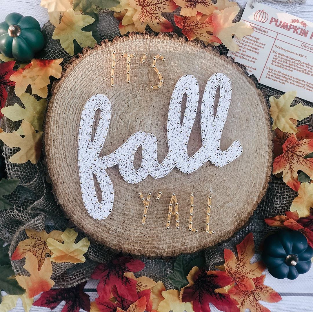 Piece of Wood with String Sign that Reads It's Fall Y'All. Photo by Instagram user @this_tangled_mess