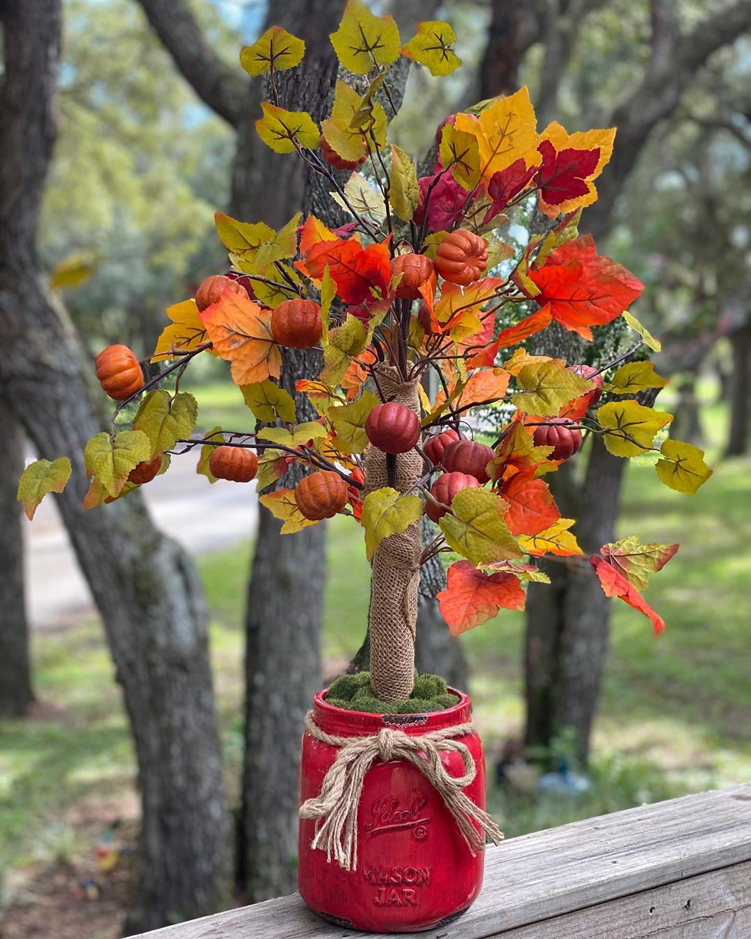 Mini Fall Tree with Pumpkins and Leaves on it. Photo by Instagram user @dreamoakdecor