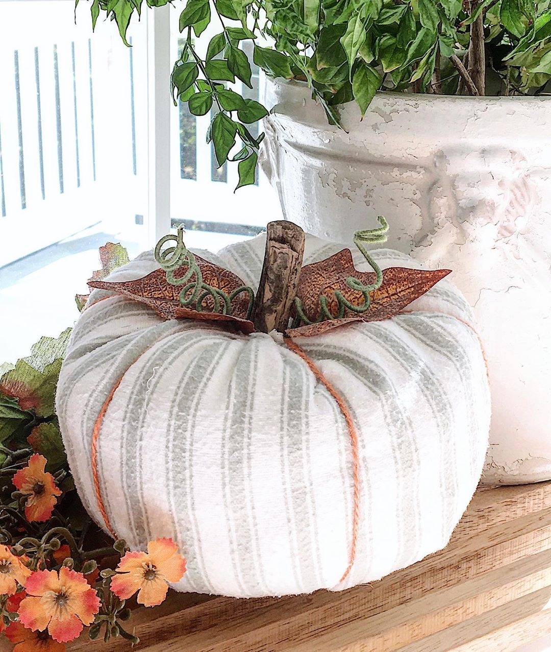 Cloth Pumpkin On a Front Porch. Photo by Instagram user @passionateforwhite