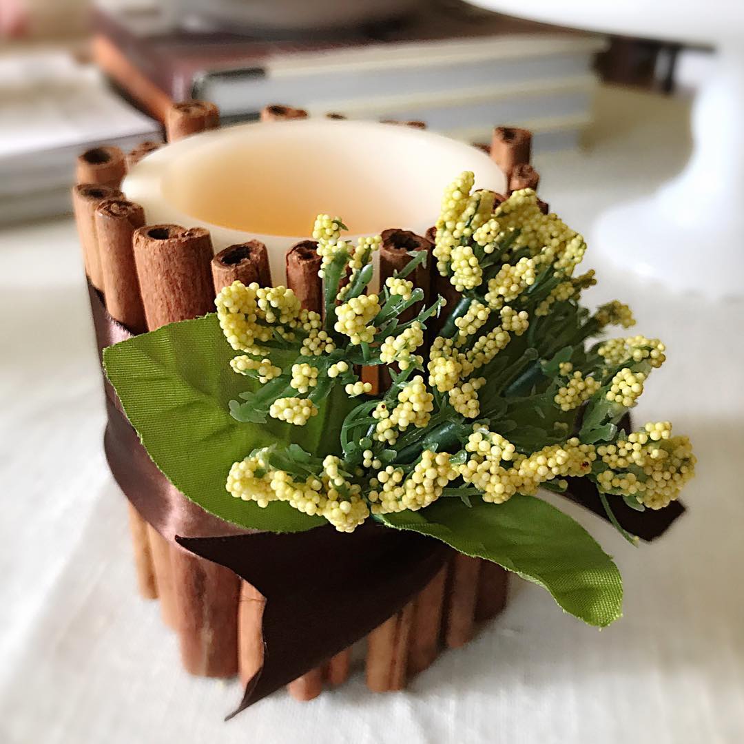 Fake Candle Surrounded by Cinnamon Sticks. Photo by Instagram user @zaneredfern