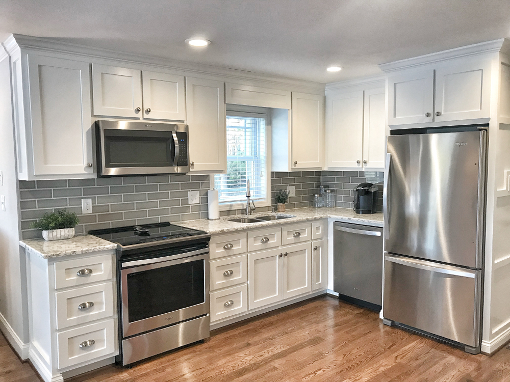 Updated Kitchen with White Cabinets, New Hardware, and Energy Saving Appliances