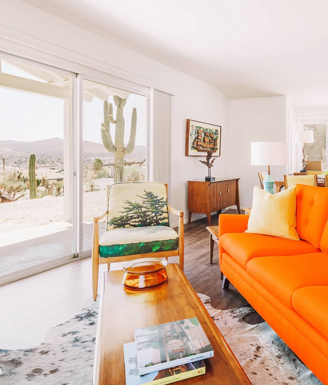 Modern Living Room with Orange Couch. Photo by Instagram user @jtreebnb