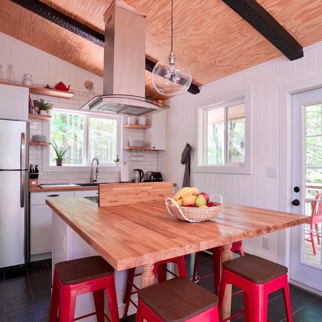 Updated Home Kitchen with Breakfast Bar and Overhanging Smoke Hood. Photo by Instagram user @tree_top_chalet