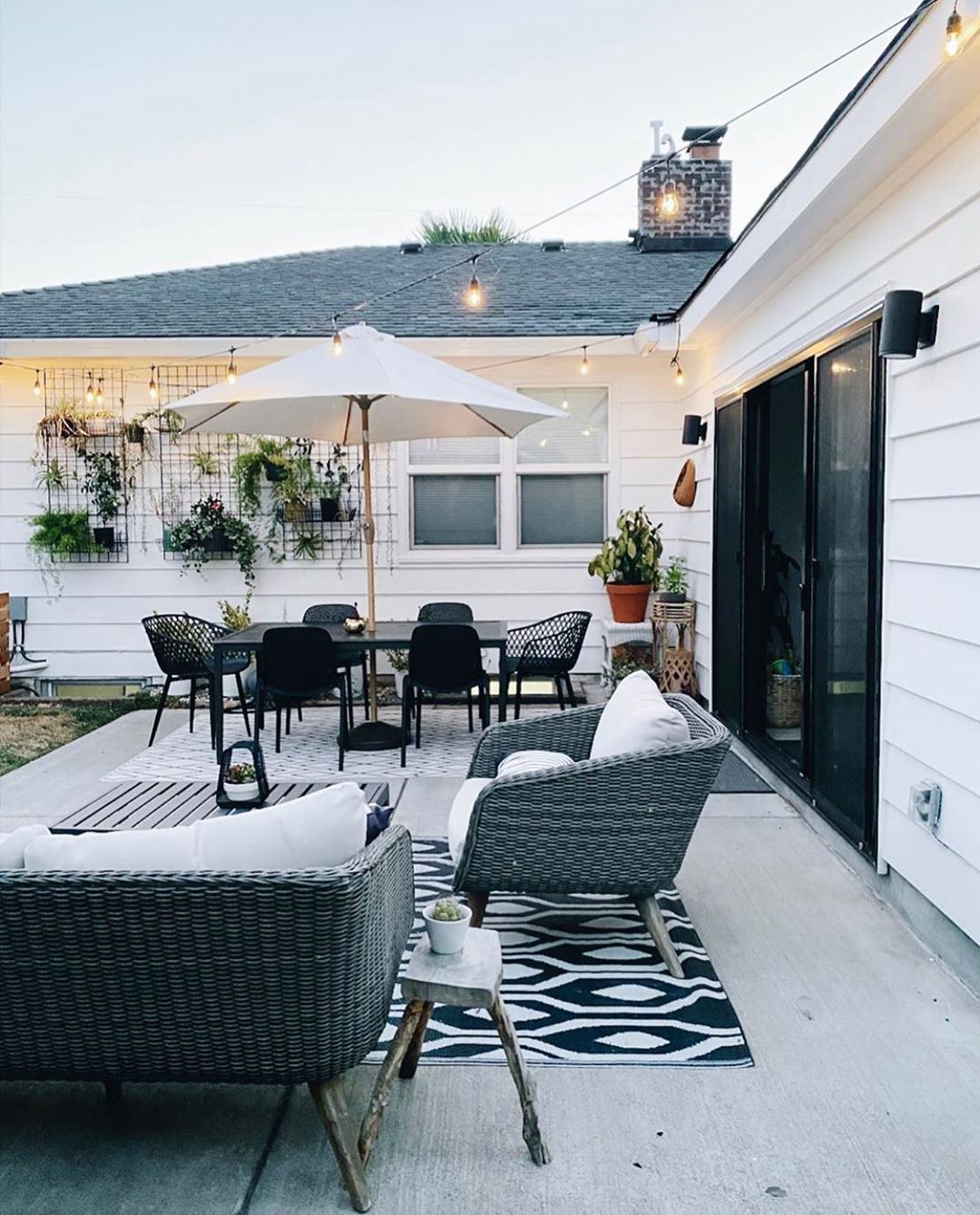 Backyard Patio with String Lights Overhead. Photo by Instagram user @arborand.co