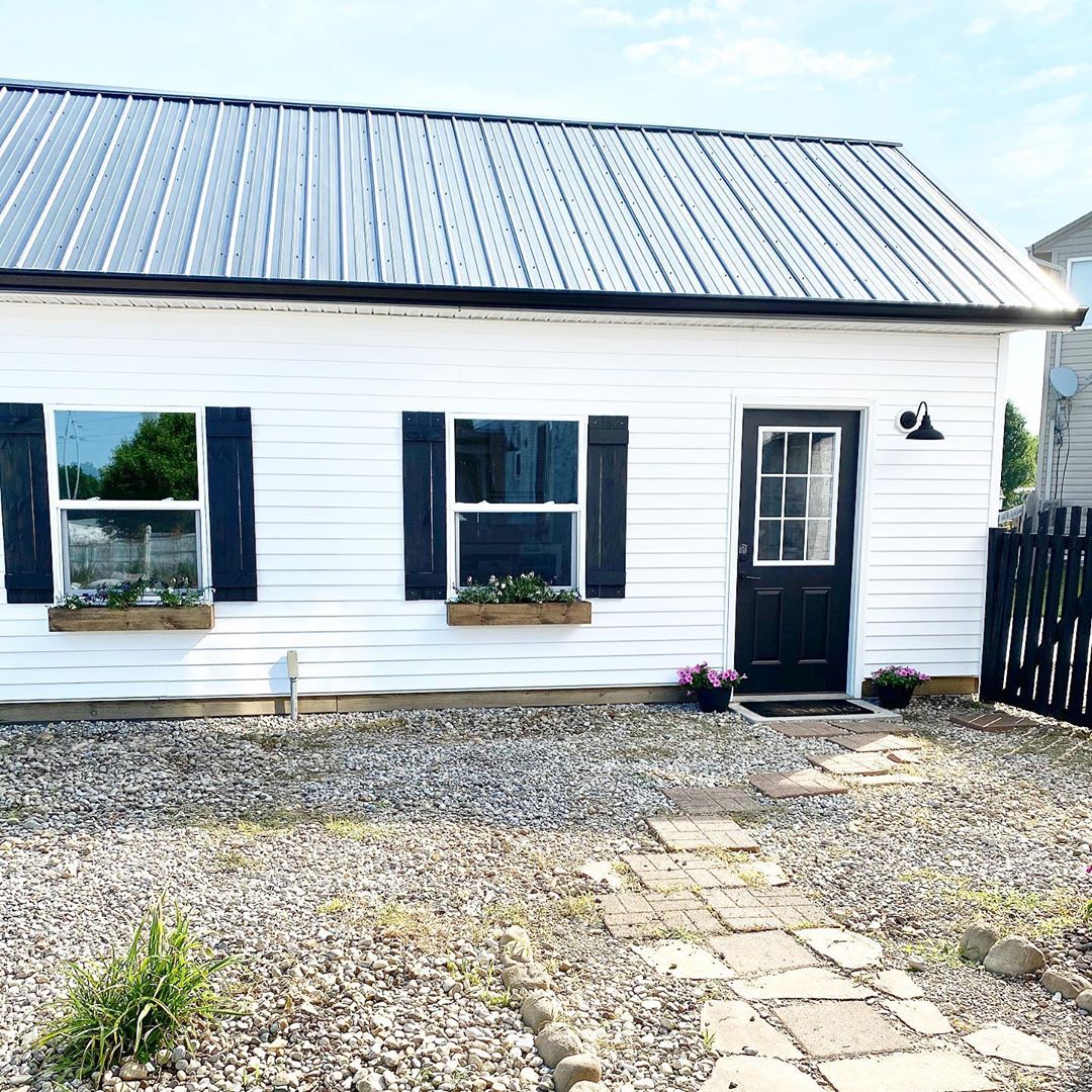 Large Black and White Detached Garage Turned into a She Shed. Photo by Instagram user @bookgirlcreations