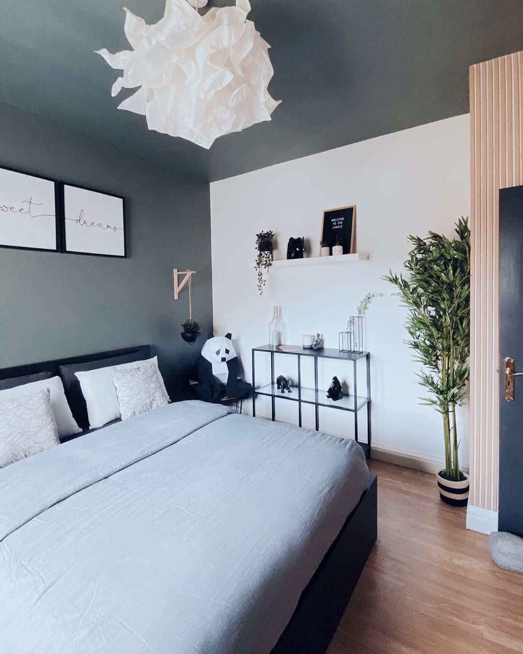 Bedroom with Gray Wall and Ceiling and White Wall. Photo by Instagram user @the.designerr