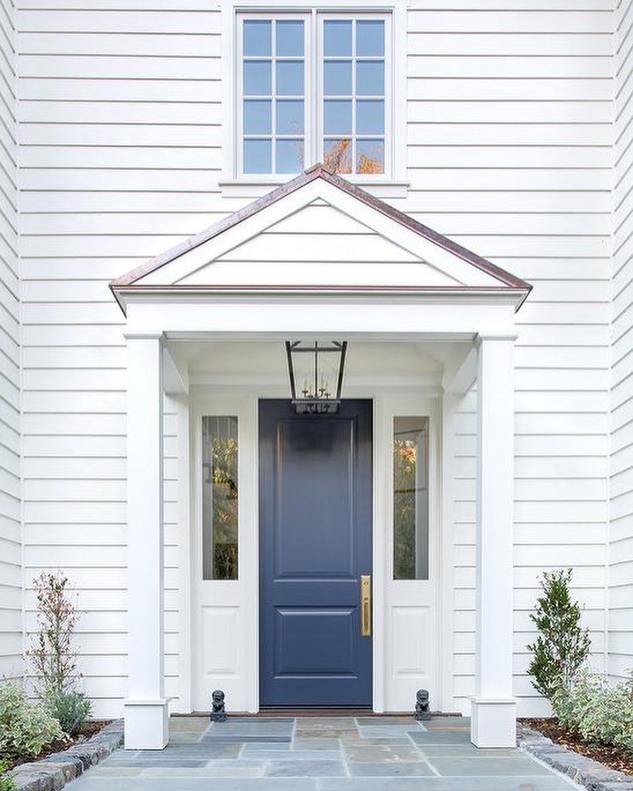 Large White House with Blue Door. Photo by Instagram user @north.carolina.realtor