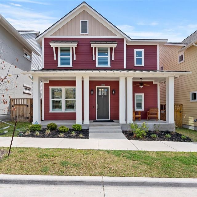 red craftsman style home with white trim. Photo by Instagram photographer @annoyed_picard