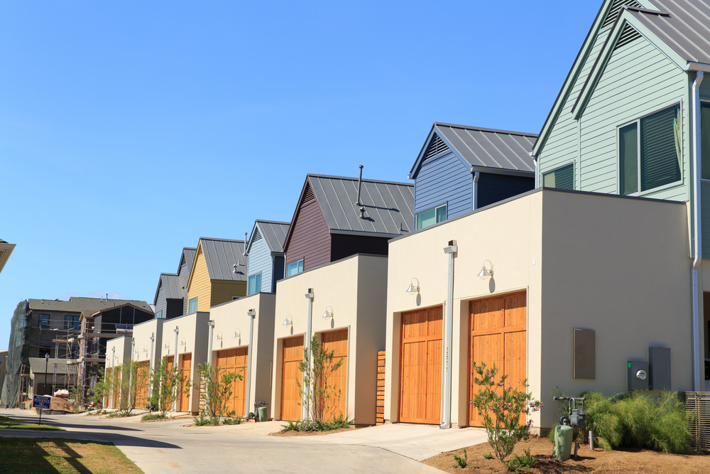 Row of Homes with Orange Garage Doors in Austin, TX