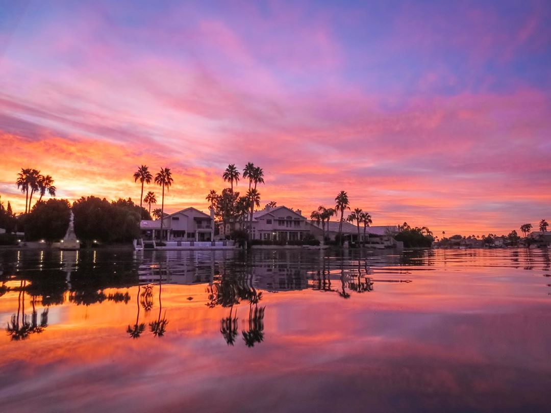 View of a Home on the Water in Gilbert, AZ at Sunrise. Photo by Instagram user @haughtshots