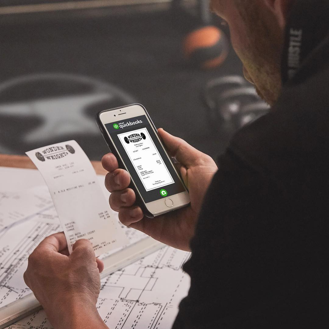 Man Taking a Photo of a Receipt Using Quickbooks. Photo by Instagram user @quickbooks