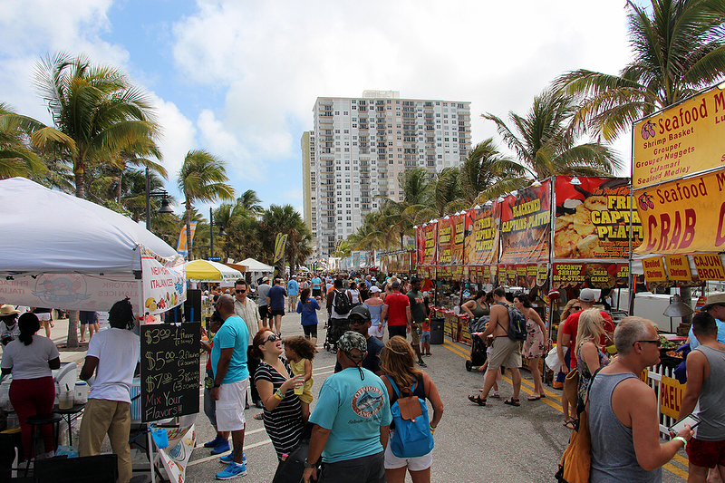 People Walking Up the Street at the Pompano Beach Sea Food festival. Photo by Instagram user @pompanobeachseafoodfest